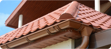 tiled roof against blue sky with clouds idea background with space text ecofriendly traditional roofs home 1 - Top Tejados Vizcaya